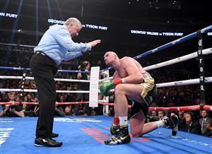 LOS ANGELES, CA - DECEMBER 01: Tyson Fury looks up as he receives a count from referee Jack Reiss in the ninth round fighting to a draw with Deontay Wilder during the WBC Heavyweight Championship at Staples Center on December 1, 2018 in Los Angeles, California. (Getty Images)