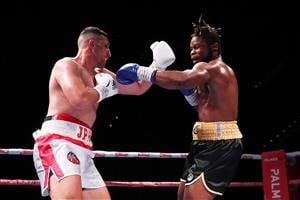 SYDNEY, AUSTRALIA - MAY 26: Justis Huni and Christian Tsoye exchange punches during the Australian Heavyweight bout between Justis Huni and Christian Tsoye at ICC Sydney on May 26, 2021 in Sydney, Australia. (Getty Images)