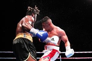 SYDNEY, AUSTRALIA - MAY 26: Justis Huni and Christian Tsoye exchange punches during the Australian Heavyweight bout between Justis Huni and Christian Tsoye at ICC Sydney on May 26, 2021 in Sydney, Australia. (Getty Images)