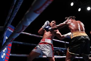 SYDNEY, AUSTRALIA - MAY 26: Justis Huni and Christian Tsoye exchange punches during the Australian Heavyweight bout between Justis Huni and Christian Tsoye at ICC Sydney on May 26, 2021 in Sydney, Australia. (Getty Images)
