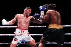 SYDNEY, AUSTRALIA - MAY 26: Justis Huni and Christian Tsoye exchange punches during the Australian Heavyweight bout between Justis Huni and Christian Tsoye at ICC Sydney on May 26, 2021 in Sydney, Australia. (Getty Images)