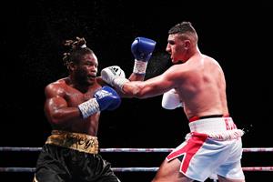 SYDNEY, AUSTRALIA - MAY 26: Justis Huni and Christian Tsoye exchange punches during the Australian Heavyweight bout between Justis Huni and Christian Tsoye at ICC Sydney on May 26, 2021 in Sydney, Australia. (Getty Images)