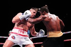 SYDNEY, AUSTRALIA - MAY 26: Justis Huni and Christian Tsoye exchange punches during the Australian Heavyweight bout between Justis Huni and Christian Tsoye at ICC Sydney on May 26, 2021 in Sydney, Australia. (Getty Images)