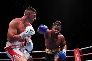 SYDNEY, AUSTRALIA - MAY 26: Justis Huni and Christian Tsoye exchange punches during the Australian Heavyweight bout between Justis Huni and Christian Tsoye at ICC Sydney on May 26, 2021 in Sydney, Australia. (Getty Images)