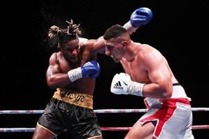 SYDNEY, AUSTRALIA - MAY 26: Justis Huni and Christian Tsoye exchange punches during the Australian Heavyweight bout between Justis Huni and Christian Tsoye at ICC Sydney on May 26, 2021 in Sydney, Australia. (Getty Images)