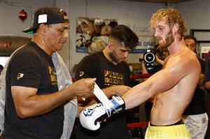MIAMI BEACH, FLORIDA - JUNE 02: Logan Paul has his hands wrapped by his coach Milton Lacroix during his media workout at the 5th St. Gym prior to his June 6th exhibition boxing match against Floyd Mayweather on June 02, 2021 in Miami Beach, Florida. (Getty Images)