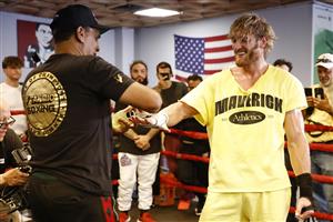 MIAMI BEACH, FLORIDA - JUNE 02: Logan Paul has his hands wrapped by his coach Milton Lacroix during his media workout at the 5th St. Gym prior to his June 6th exhibition boxing match against Floyd Mayweather on June 02, 2021 in Miami Beach, Florida. (Getty Images)