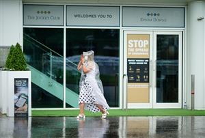 EPSOM, ENGLAND – JUNE 4: Racegoers arrive during day one of the Cazoo Derby Festival at Epsom Racecourse on June 4, 2021 in Epsom, England. (Photo by John Walton-Pool/Getty Images)