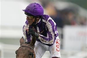 EPSOM, ENGLAND - JUNE 04: Frankie Dettori celebrates as he rides Snowfall to win The Cazoo Oaks by sixteen lengths at Epsom Racecourse on June 04, 2021 in Epsom, England. Due to the Coronavirus pandemic only owners along with a limited number of the paying public will be allowed to attend the meeting. (Photo by Alan Crowhurst/Getty Images)