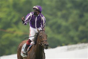 EPSOM, ENGLAND - JUNE 04: Frankie Dettori celebrates after riding Snowfall to win The Cazoo Oaks by sixteen lengths at Epsom Racecourse on June 04, 2021 in Epsom, England. Due to the Coronavirus pandemic only owners along with a limited number of the paying public will be allowed to attend the meeting. (Photo by Alan Crowhurst/Getty Images)