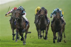 EPSOM, ENGLAND - JUNE 04: Hollie Doyle riding Corazon Espinado (L, hooped cap) win The Coral 'Beaten By A Length' Free Bet Handicap at Epsom Racecourse on June 04, 2021 in Epsom, England. Due to the Coronavirus pandemic only owners along with a limited number of the paying public will be allowed to attend the meeting. (Photo by Alan Crowhurst/Getty Images)