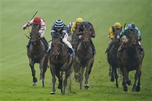 EPSOM, ENGLAND - JUNE 04: Hollie Doyle riding Corazon Espinado (L, hooped cap) win The Coral 'Beaten By A Length' Free Bet Handicap at Epsom Racecourse on June 04, 2021 in Epsom, England. Due to the Coronavirus pandemic only owners along with a limited number of the paying public will be allowed to attend the meeting. (Photo by Alan Crowhurst/Getty Images)