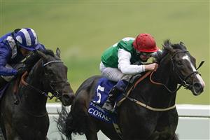 EPSOM, ENGLAND - JUNE 04: Martin Dwyer riding Pyledriver (red cap) win The Coral Coronation Cup from Jim Crowley and Al Aasy (blue) at Epsom Racecourse on June 04, 2021 in Epsom, England. Due to the Coronavirus pandemic only owners along with a limited number of the paying public will be allowed to attend the meeting. (Photo by Alan Crowhurst/Getty Images)