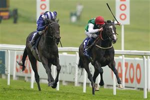 EPSOM, ENGLAND - JUNE 04: Martin Dwyer riding Pyledriver (red cap) win The Coral Coronation Cup from Jim Crowley and Al Aasy (blue) at Epsom Racecourse on June 04, 2021 in Epsom, England. Due to the Coronavirus pandemic only owners along with a limited number of the paying public will be allowed to attend the meeting. (Photo by Alan Crowhurst/Getty Images)