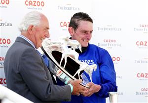 EPSOM, ENGLAND - JUNE 05: Jockey Adam Kirby (right) celebrates with the trophy after winning the Cazoo Derby with Adayar during day two of the Cazoo Derby Festival at Epsom Racecourse on June 5, 2021 in Epsom, England. (Photo by John Walton-Pool/Getty Images)