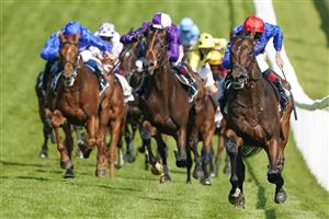 EPSOM, ENGLAND - JUNE 05: Adam Kirby riding Adayar (red cap) win The Cazoo Derby at Epsom Racecourse on June 05, 2021 in Epsom, England. Due to the Coronavirus pandemic, only owners along with a limited number of the paying public will be allowed to attend the meeting. (Photo by Alan Crowhurst/Getty Images)
