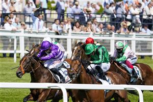 EPSOM, ENGLAND - JUNE 05: Tom Marquand riding Oh This Is Us (purple) win The Cazoo Diomed Stakes at Epsom Racecourse on June 05, 2021 in Epsom, England. Due to the Coronavirus pandemic, only owners along with a limited number of the paying public will be allowed to attend the meeting. (Photo by Alan Crowhurst/Getty Images)