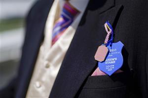 EPSOM, ENGLAND - JUNE 05: Lapel badge on Derby Day at Epsom Racecourse on June 05, 2021 in Epsom, England. Due to the Coronavirus pandemic, only owners along with a limited number of the paying public will be allowed to attend the meeting. (Photo by Alan Crowhurst/Getty Images)