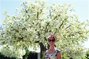 Racegoer Jennifer Loomes poses for a photograph as she wait for the racing to begin on the second day of the Epsom Derby Festival horse racing event in Surrey, southern England on June 5, 2021. (Photo by Glyn KIRK / AFP) (Photo by GLYN KIRK/AFP via Getty Images)