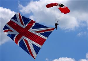 EPSOM, ENGLAND - JUNE 05: A member of the Red Devils Parachute display team parachutes onto the course during day two of the Cazoo Derby Festiv at Epsom Racecourse on June 5, 2021 in Epsom, England. (Photo by John Walton - Pool/Getty Images)