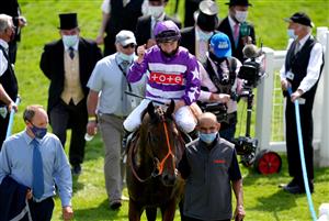 EPSOM, ENGLAND - JUNE 05: Tom Marquand celebrates on top of Oh This Is Us is led into the winners enclosure after winning the Cazoo Diomed Stakes during day two of the Cazoo Derby Festival at Epsom Racecourse on June 5, 2021 in Epsom, England. (Photo by John Walton-Pool/Getty Images)