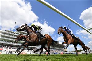 Solent Gateway ridden by Hayley Turner (L) leads the pack during the World Pool At The Tote Handicap Stakes race on the second day of the Epsom Derby Festival horse racing event at Epsom Downs Racecourse in Surrey, southern England on June 5, 2021. (Photo by Glyn KIRK / AFP) (Photo by GLYN KIRK/AFP via Getty Images)