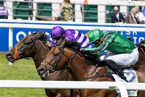EPSOM, ENGLAND - JUNE 05: Tom Marquand riding Oh This Is Us (purple) win The Cazoo Diomed Stakes at Epsom Racecourse on June 05, 2021 in Epsom, England. Due to the Coronavirus pandemic, only owners along with a limited number of the paying public will be allowed to attend the meeting. (Photo by Alan Crowhurst/Getty Images)