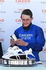 Adam Kirby poses with the trophy after riding Adayar to victory in the Epsom Derby on the second day of the Epsom Derby Festival horse racing event at Epsom Downs Racecourse in Surrey, southern England on June 5, 2021. (Photo by Glyn KIRK / AFP) (Photo by GLYN KIRK/AFP via Getty Images)