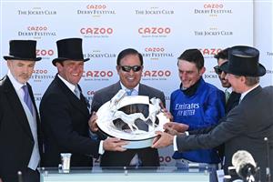 Trainer Charlie Appleby (2L) and jockey Adam Kirby (2R) pose with the trophy on winning the Epsom Derby on the second day of the Epsom Derby Festival horse racing event at Epsom Downs Racecourse in Surrey, southern England on June 5, 2021. (Photo by Glyn KIRK / AFP) (Photo by GLYN KIRK/AFP via Getty Images)