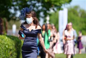 EPSOM, ENGLAND - JUNE 05: Racegoers arrive for day two of the Cazoo Derby Festival at Epsom Racecourse on June 5, 2021 in Epsom, England. (Photo by John Walton-Pool/Getty Images)