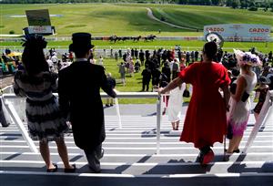 EPSOM, ENGLAND - JUNE 05: A general view of racegoers as they watch Oh This Is Us ridden by Tom Marquand on their way to winning the Cazoo Diomed Stakes during day two of the Cazoo Derby Festival at Epsom Racecourse on June 5, 2021 in Epsom, England. (Photo by John Walton-Pool/Getty Images)