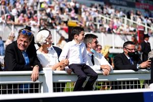 EPSOM, ENGLAND - JUNE 05: Simon Cowell and Lauren Silverman along with their son Eric and watch the action from Cazoo Derby during day two of the Cazoo Derby Festival at Epsom Racecourse on June 5, 2021 in Epsom, England. (Photo by John Walton-Pool/Getty Images)