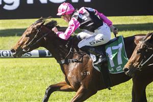 SYDNEY, AUSTRALIA - JUNE 05: Louise Day (pink) on Distillate wins race 2 the TAB highway Class 3 handicap during Sydney Racing at Rosehill Gardens on June 05, 2021 in Sydney, Australia. (Photo by Jenny Evans/Getty Images)