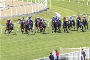 SYDNEY, AUSTRALIA - JUNE 05: Louise Day (pink) on Distillate wins race 2 the TAB highway Class 3 handicap during Sydney Racing at Rosehill Gardens on June 05, 2021 in Sydney, Australia. (Photo by Jenny Evans/Getty Images)