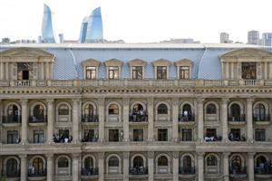 People watch the Formula One Azerbaijan Grand Prix at the Baku City Circuit in Baku on June 6, 2021. (Getty Images)