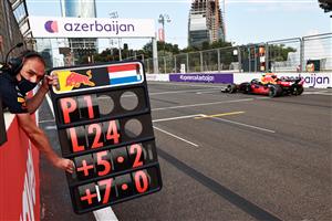 BAKU, AZERBAIJAN - JUNE 06: Max Verstappen of the Netherlands driving the (33) Red Bull Racing RB16B Honda passes his pit board marker on lap 24 during the F1 Grand Prix of Azerbaijan at Baku City Circuit on June 06, 2021 in Baku, Azerbaijan. (Getty Images)