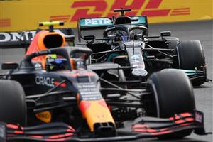 Red Bull's Mexican driver Sergio Perez and Mercedes' British driver Lewis Hamilton steer their cars during the Formula One Azerbaijan Grand Prix at the Baku City Circuit in Baku on June 6, 2021. (Photo by OZAN KOSE / AFP) (Getty Images)