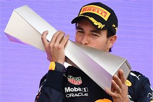 TOPSHOT - Red Bull's Mexican driver Sergio Perez celebrates on the podium after winning the Formula One Azerbaijan Grand Prix at the Baku City Circuit in Baku on June 6, 2021. (Getty Images)