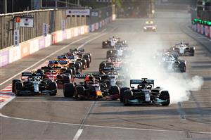 BAKU, AZERBAIJAN - JUNE 06: Lewis Hamilton of Great Britain driving the (44) Mercedes AMG Petronas F1 Team Mercedes W12 locks up under pressure from Sergio Perez of Mexico driving the (11) Red Bull Racing RB16B Honda into the first corner after the restart following a red flag period during the F1 Grand Prix of Azerbaijan at Baku City Circuit on June 06, 2021 in Baku, Azerbaijan. (Getty Images)