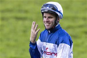 SYDNEY, AUSTRALIA - JUNE 05: Tommy Berry hold all four fingers after he won four races during Sydney Racing at Rosehill Gardens on June 05, 2021 in Sydney, Australia. (Photo by Jenny Evans/Getty Images)