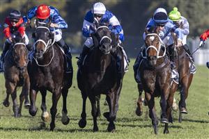 SYDNEY, AUSTRALIA - JUNE 05: Tommy Berry (black cap) on Great House wins race 6 the The Agency Real Estate Handicap during Sydney Racing at Rosehill Gardens on June 05, 2021 in Sydney, Australia. (Photo by Jenny Evans/Getty Images)
