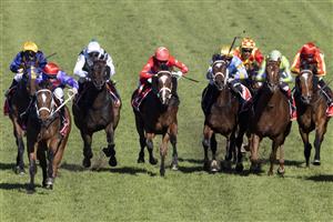 SYDNEY, AUSTRALIA - JUNE 05: Tommy Berry (red diamonds) on Oscar Zulu wins race 4 the Fujitsu General Handicap during Sydney Racing at Rosehill Gardens on June 05, 2021 in Sydney, Australia. (Photo by Jenny Evans/Getty Images)