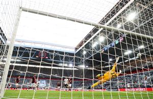 DUESSELDORF, GERMANY - JUNE 07: Ilkay Gundogan of Germany scores their sides second goal past Roberts Ozols of Latvia during the international friendly match between Germany and Latvia at Merkur Spiel-Arena on June 07, 2021 in Duesseldorf, Germany. (Getty Images)