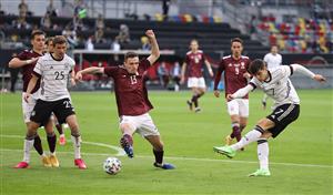DUESSELDORF, GERMANY - JUNE 07: Kai Havertz of Germany has a shot on goal whilst under pressure from Raivis Jurkovskis of Latvia during the international friendly match between Germany and Latvia at Merkur Spiel-Arena on June 07, 2021 in Duesseldorf, Germany. (Getty Images)