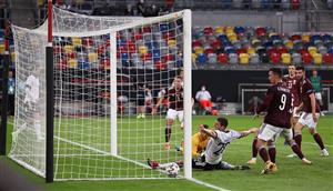 DUESSELDORF, GERMANY - JUNE 07: Kai Havertz of Germany (L) scores their sides fourth goal past Roberts Ozols of Latvia during the international friendly match between Germany and Latvia at Merkur Spiel-Arena on June 07, 2021 in Duesseldorf, Germany. (Getty Images)