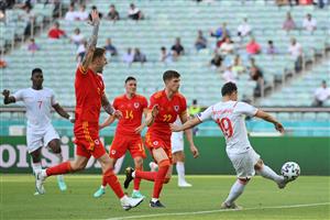 Wales' defender Joe Rodon (L) gestures for offside as Switzerland's forward Mario Gavranovic (R) shoots from an offside position during the UEFA EURO 2020 Group A football match between Wales and Switzerland at the Olympic Stadium in Baku on June 12, 2021. (Getty Images)