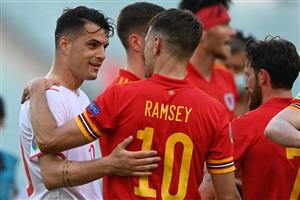 Switzerland's midfielder Granit Xhaka (L) speaks with Wales' midfielder Aaron Ramsey after the UEFA EURO 2020 Group A football match between Wales and Switzerland at the Olympic Stadium in Baku on June 12, 2021. (Getty Images)