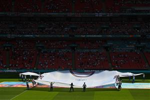 Volunteers hold a giant replica of the England jersey ahead of the UEFA EURO 2020 Group D football match between England and Croatia at Wembley Stadium in London on June 13, 2021. (Getty Images)