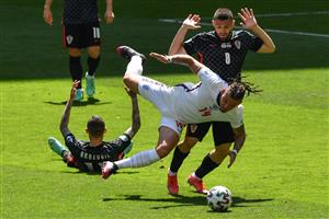 TOPSHOT - Croatia's midfielder Mateo Kovacic fouls England's midfielder Kalvin Phillips during the UEFA EURO 2020 Group D football match between England and Croatia at Wembley Stadium in London on June 13, 2021. (Getty Images)