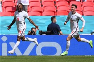 England's forward Raheem Sterling (L) celebrates scoring the team's first goal during the UEFA EURO 2020 Group D football match between England and Croatia at Wembley Stadium in London on June 13, 2021. (Getty Images)